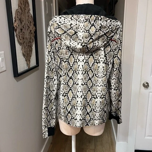 ALALA snakeskin anorak with red accents